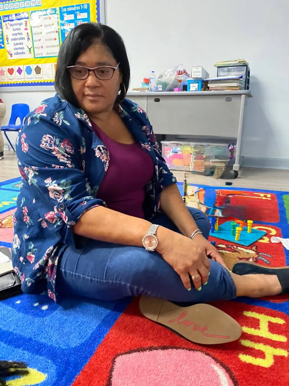 Mrs. B on a classroom rug